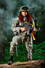 Ukranian female soldier in the forest