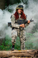 Ukranian female soldier in the forest