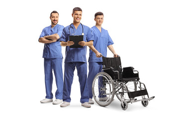 Male health care workers in blue uniforms with a wheelchair