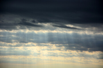 Sun through the stormy clouds. Natural background