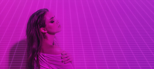 Portrait of female fashion model in neon pink light on dark studio background with virtual grid. Beautiful woman with fashionable make-up and well-groomed skin. Bright style, beauty and the 
