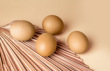Golden dyed Easter eggs on beige background. Celebration of religious holiday concept. Organic farm eco food. High quality photo