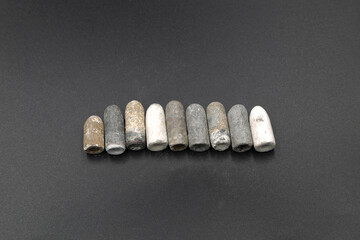 Antique lead bullets on black background