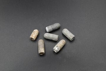 Antique lead bullets on black background