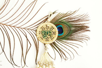 sign with indian hindi text shubh(means goodness)and peacock feather hindu religion holy symbols