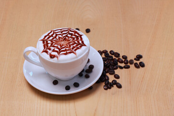 Hot latte coffee cup and beans isolated on wooden table