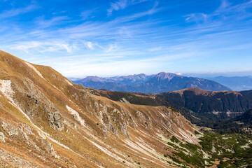 Panoramic view from Seckauer Zinken in the Lower Tauern mountain range, Styria, Austria, Europe. Eisenerz Alps in the distance. Sunny autumn day in the Seckau Alps. bare and rocky terrain. Wanderlust