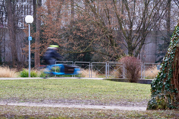 Bicycle lane. 1 male cyclist in the park. Man motion blurred. Healthy lifestyle with exercise....