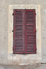 Fototapeta na wymiar Close Up of Old Closed Wooden Shutters on Window 