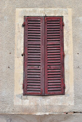 Fototapeta premium Close Up of Old Closed Wooden Shutters on Window 