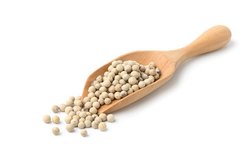 White peppercorns (white pepper) in wooden scoop isolated on white background.