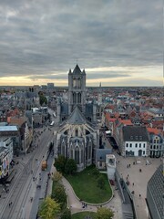 cityscape & st bavo cathedral in ghent, belgium during sunset