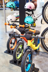 Children bicycles and helmets in sport store