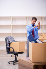 Fototapeta na wymiar Young male employee in office relocation concept