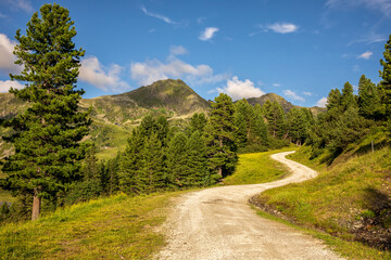 road in mountains with blue sky