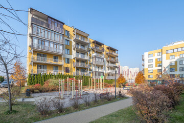 Fototapeta premium Apartment building with children's and sports ground in Kiev Lipinka
