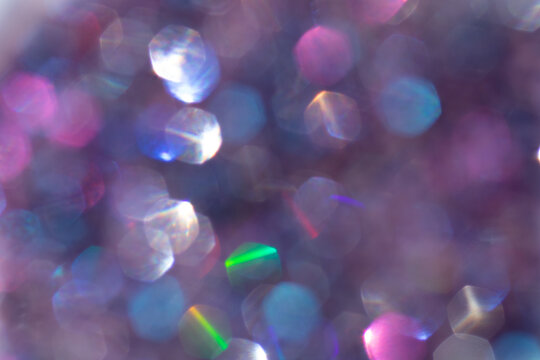 Abstract defocused multicolored background with shining glitter.Good as overlay layer.
