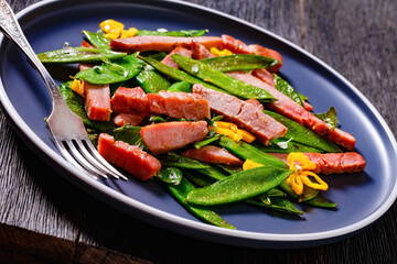 fried sugar snap peas with tuna slices