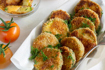 Breaded fried pieces of healthy yummy vegetables with tomatoes and sauce. Healthy lifestyle concept 
