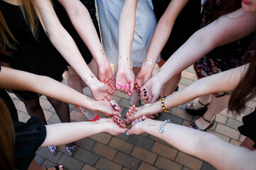 Many girls gathered together for a bachelorette party to celebrate together. Everyone shows their beautiful handles and manicures