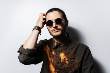 Obraz premium Studio portrait of young serious man on white background.