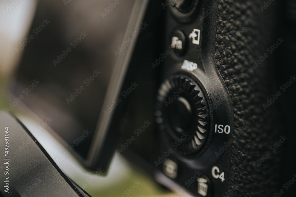 Aufkleber selective focus shot of iso button of a digital camera with flip screen