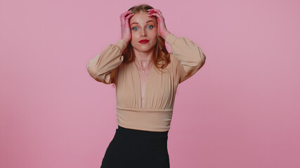 Excited amazed businesswoman girl 20s raising hands in surprise looking shocked surprised wow showing hands brain explosion head gesture. Sincere young adult woman isolated on pink wall background