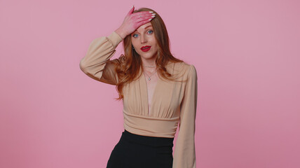 Upset businesswoman girl in beige blouse making face palm gesture, feeling bored, disappointed in result of work, bad news. Young casual woman posing alone isolated on pink studio wall background.