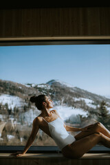 Young woman relaxing in the spa at winter season