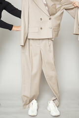people keep a women's beige suit on the weight