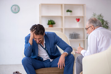 Young businessman employee visiting psychologist