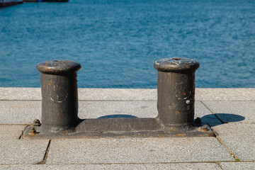 Old vintage marina bollard (bitt) for boats