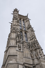 Fototapeta na wymiar Saint-Jacques Tower (Tour Saint-Jacques) located on Rivoli street in Paris, France. This 52 m Flamboyant Gothic tower is all that remains of former XVI century Church of Saint-Jacques-de-la-Boucherie.