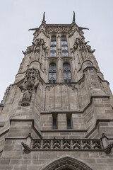 Fototapeta premium Saint-Jacques Tower (Tour Saint-Jacques) located on Rivoli street in Paris, France. This 52 m Flamboyant Gothic tower is all that remains of former XVI century Church of Saint-Jacques-de-la-Boucherie.
