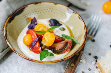 Mix tomatoes with capers and tuna cream. Tomato menu in a restaurant.