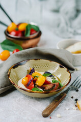 Mix tomatoes with capers and tuna cream. Tomato menu in a restaurant.