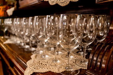 Wine glasses are on the table in front of the banquet.