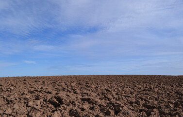 Closeup shot of a Ploughed field and blue sky