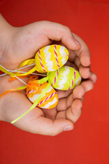 easter eggs in the hands of a child