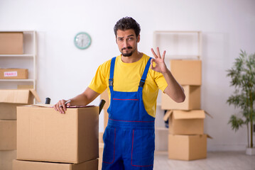 Young male contractor doing home relocation