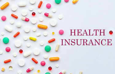text health insurance. Many different pills on white background, flat lay.Global Pharmaceutical Industry and Medicinal Products - Colorful Pills, Tablets and Capsules, medicine and drug concept