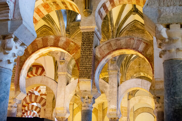 Medieval moorish architecture, colorful achways with columns in old mosque in Cordoba with no...