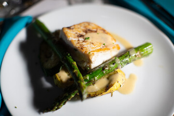 Closeup shot of a gourmet salmon and asparagus dish at a country club in New Jersey
