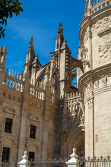 Fototapeta na wymiar Old historical Andalusian town Seville, Spain. View on architectural details of Gothic cathedral church.