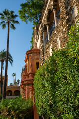 Naklejka premium Royal palace green gardens in Mudejar style. Old historical Andalusian town Seville, Spain.