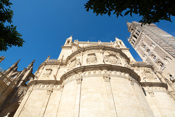 Old historical Andalusian town Seville, Spain. View on architectural details of Gothic cathedral church.