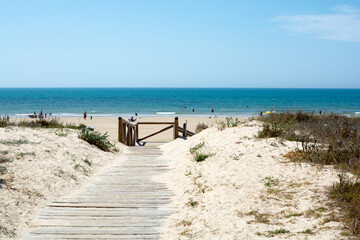 Fototapeta na wymiar Golden sandy beaches near Sanlucar de Barrameda, small Andalusian town, Spain