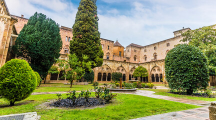 A view across a courtyard in the cathedral in the city of Tarragona on a spring day