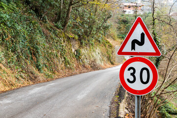 Dangerous turns and speed limit road signs