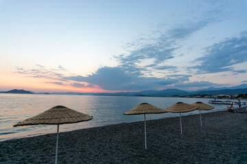 sunset beach sun beds parasol